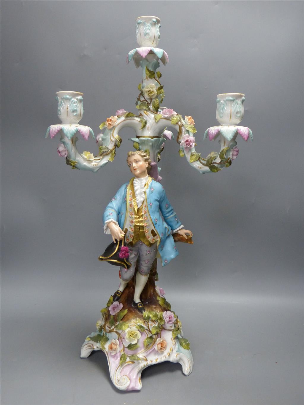 A pair of early 20th century Plaue porcelain figural candelabra, overall height 48cm